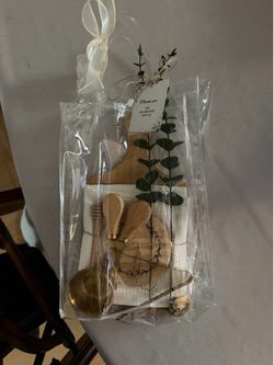 Clear  gift bag with charcuterie, board and utensils