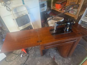 Old singer sewing machine and cabinet