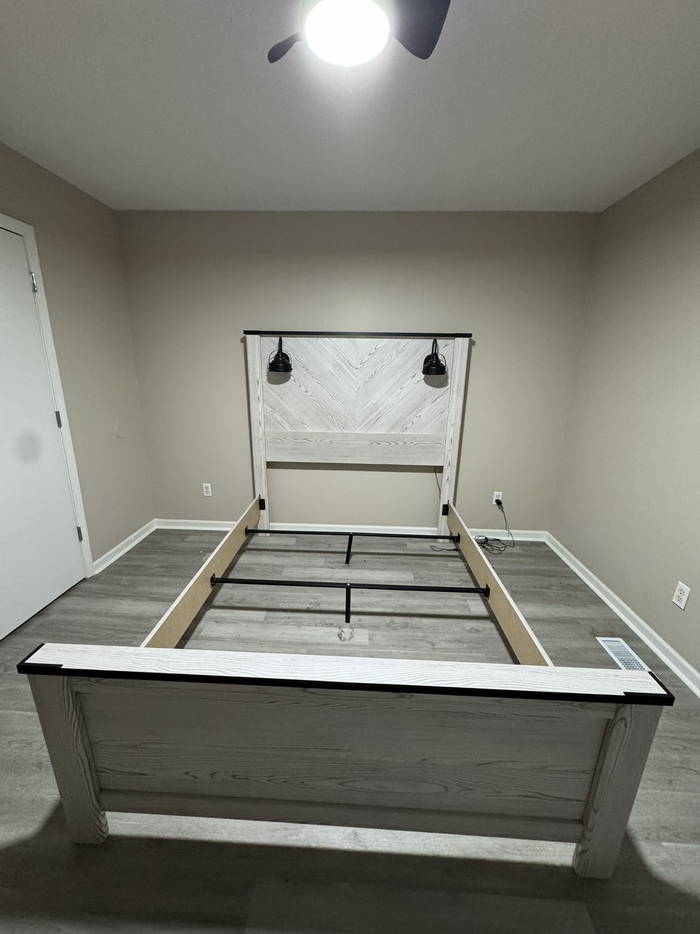 bed set with lamps overhead