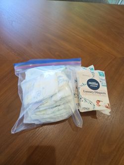 Assorted newborn diapers at least 15