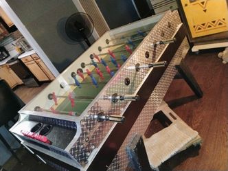 Foosball table coin operated