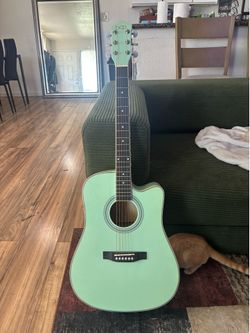 Teal beginner guitar