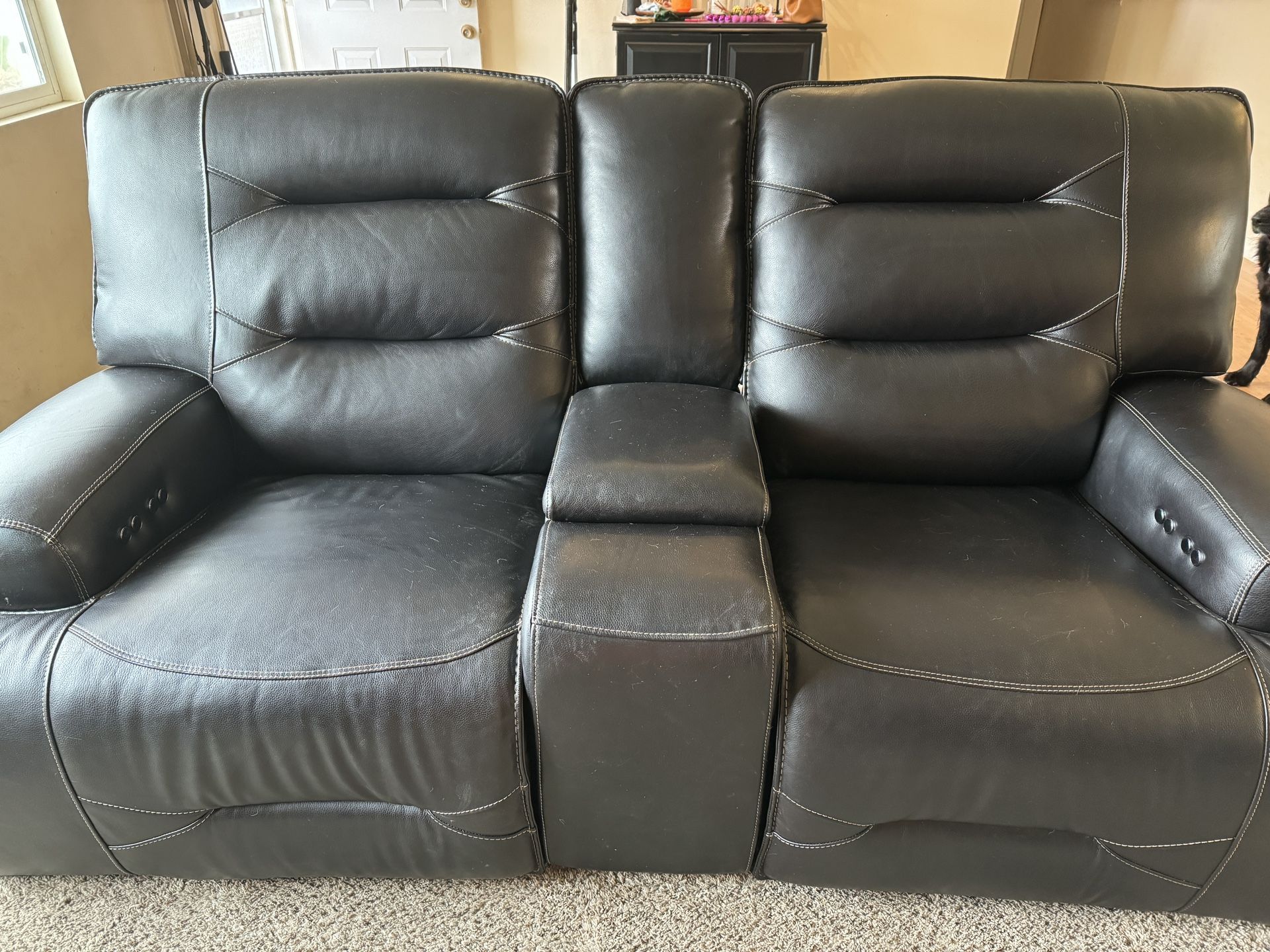 Dual power reclining loveseat with consol