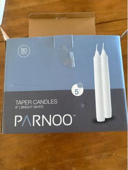 69 white taper candles unused.