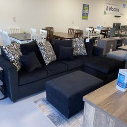 Black Sectional With Designed Pillows 