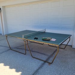 Indoor Ping Pong table with 2 nets, 5 paddles, 8 balls and instructions.  ,