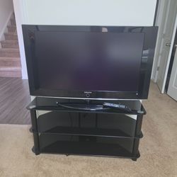 Selling as a bundle: Samsung 40-inch TV and a universally compatible 3-tier black glass media stand.