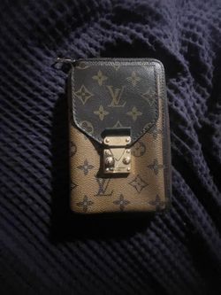 LV vertical zippy wallet metis