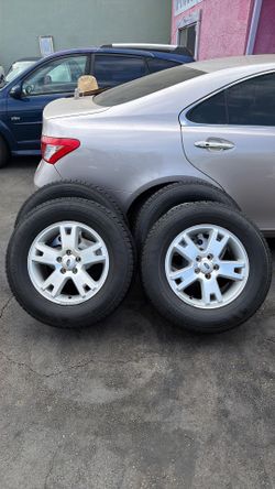 225/65R17 Tires & OEM Ford Explorer Rims - Kumho HT51 - Complete Set