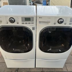 LG Front Load Washer And Electric Dryer On Pedestals