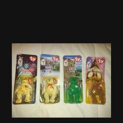 Set of 4 TY Beanie Babies Glory,  Erin,  Britannia, And  Maple the Bear McDonalds 1999. New, unopened, plastic packing is yellowed.