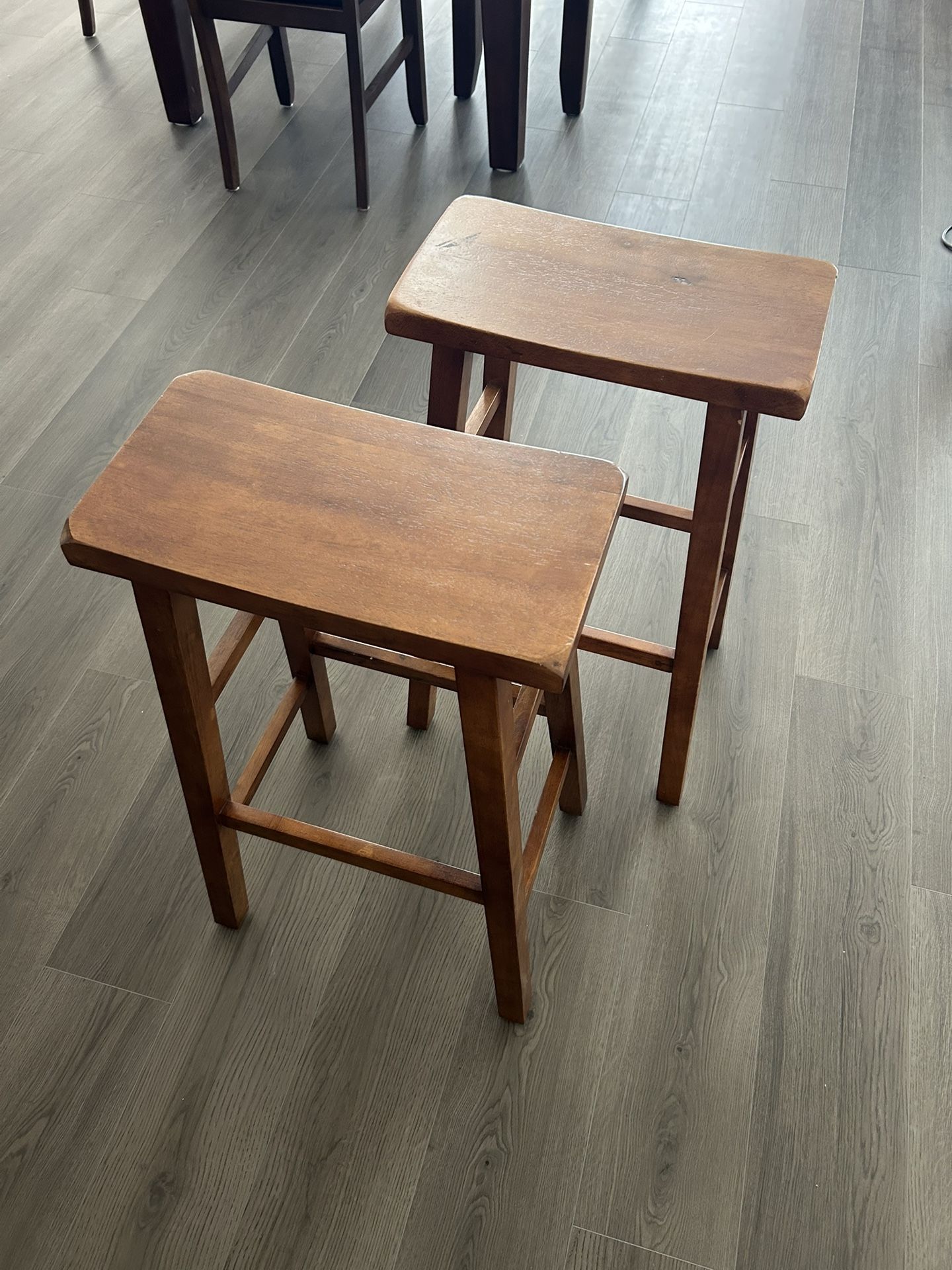 Two Wooden Saddle Style Bar Stools