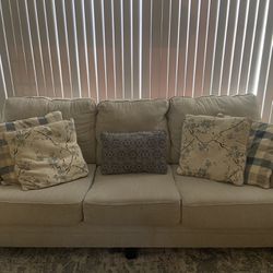 Beige Couch With Pillows 