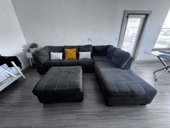 Gray Sectional with Pull-Out Bed + Ottoman