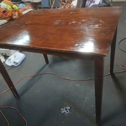 Table and good condition made for bar stools.