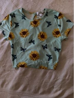 Ribbed mint green tee with sunflower and butterfly print.