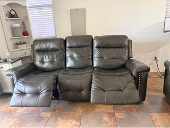 Leather reclining sofa and loveseat set