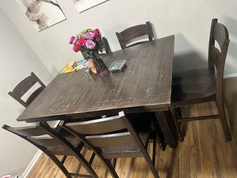 Solid wood dining room table with six chairs