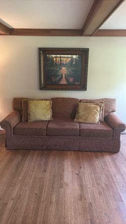 94” Couch with pillows and picture