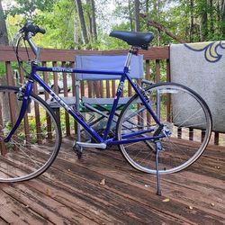 His and Hers Trail Bikes With Kid Carrier