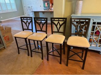 4 tan bar stools