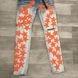 Amiri jeans with orange stars