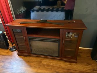 Entertainment stand with electric fireplace built in