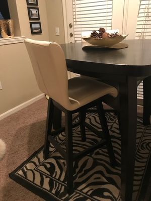 Photo Pub table, two chairs and one bench. Purchased from Rooms To Go in 2015 for $799.00, asking $400.00 or best offer. There are two minor scratches on