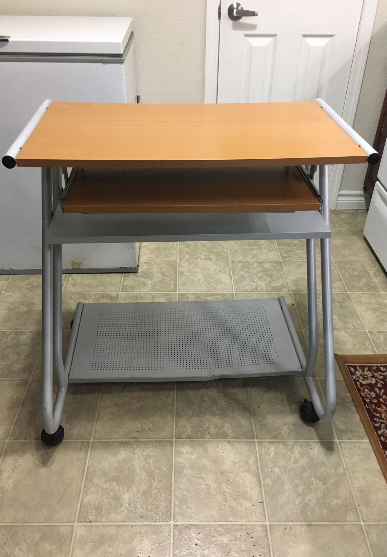 COMPUTER DESK WITH SLIDING KEYBOARD AND ROLLING WHEELS