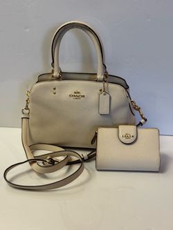 Coach Mini Lillie Carryall in Chalk crossgrain leather features polished gold-tone hardware, two handles, and a detachable shoulder strap