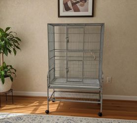 56” Large Rolling Metal Bird Cage House! Good condition! The two door locks broke, but are currently locked with Metal Safety Pins which work really w