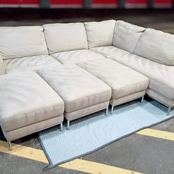 Free Delivery Today. Like New Steam Cleaned L Sectional With 3 Ottomans(Optional)  . Grey In Color.