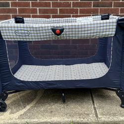 Cosco Pack 'n Play Portable Playpen (plaid dog, bear, & cat print)