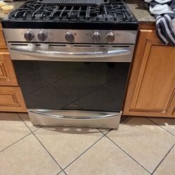 Entertainment center, gas stove, full size fridge, Queen size bed complete, washer and dryer, king size adjustable bed frame