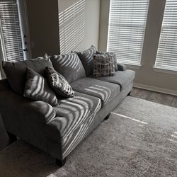 Couch, Rug, and 55” TV