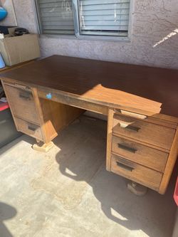 This is a mid-century (circa 1950s–1970s) solid wood executive double-pedestal desk