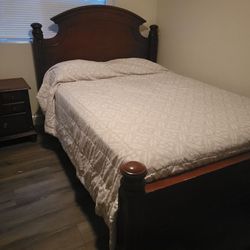 Queen bed, box spring, mattress and frame.