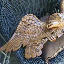 An eagle carved out of wood shed size for the 60s