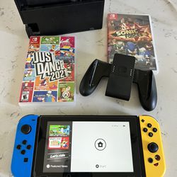 Nintendo Switch + 2 games + Joy Con + Dock + Charger 