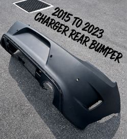 New Dodge Charger Scat Pack Hellcat Rear Bumper with Sensor Holes OEM material NEVER FOLDED fits 2015 to 2023