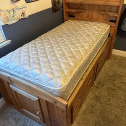 Twin bed with four drawers and secret compartment in the back