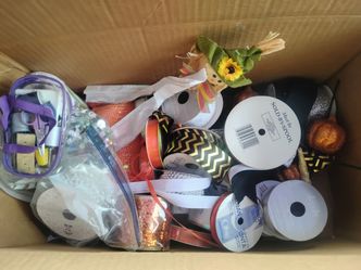 Box of craft ribbons and fabric