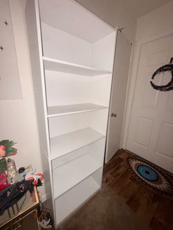 Tall white bookshelf