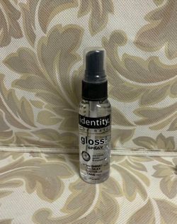 Identity gloss spray