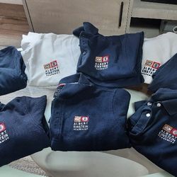 Uniforms, Polo Shirts, Sweaters, and a Windbreaker  Jacket .