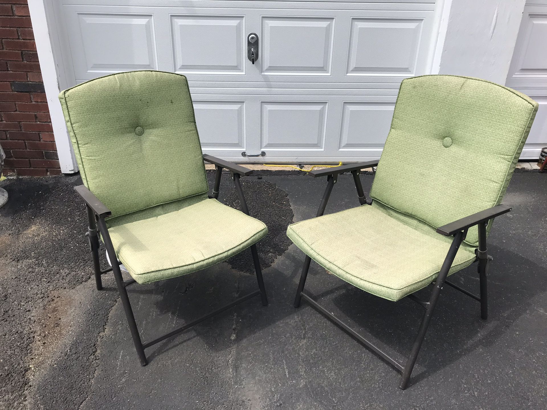 2 green pillowed comfortable outdoor/indoor patio furniture chairs. (Foldable)