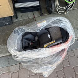 Brand new car seat with bass, black and gray
