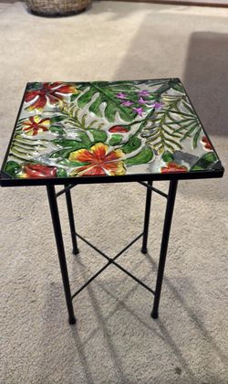 Beautiful metal black table with glass floral pattern