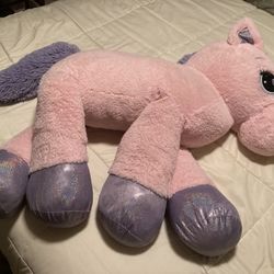 Pink unicorn stuffed animal