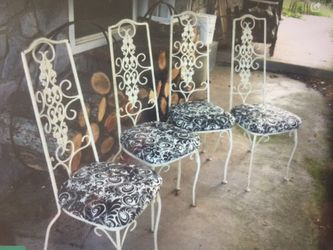 Heavy Iron chairs. New seat covers. Chippy paint. Really nice set.